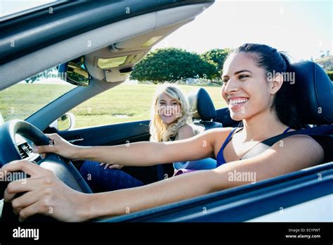 Excited Women Driving Convertible On Road Trip Stock Photo Alamy