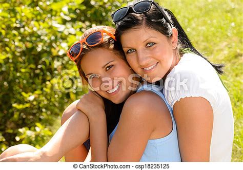 Mother And Teen Daughter Hugging Outdoors Relaxing Smiling Summer Loving Canstock