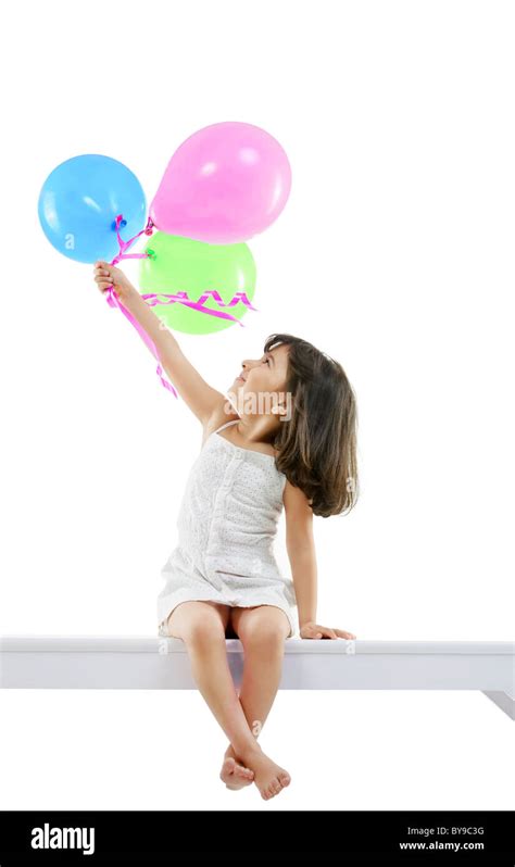 Girl Holding Balloons Stock Photo Alamy