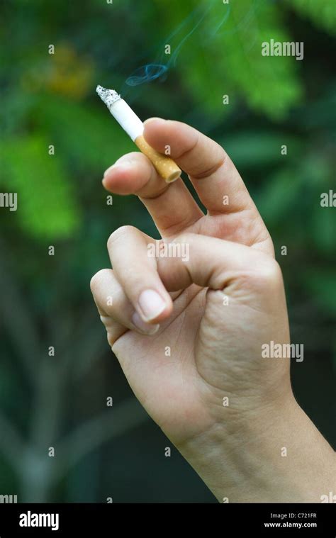 Womans Hand Holding Cigarette Stock Photo Alamy