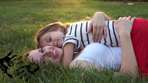 Mother And Daughter Lying On Grass Kiss Youtube