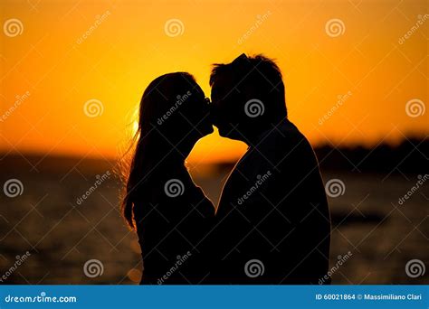 Young Couple Kissing On The Beach Sunset Stock Photo Image Of Color