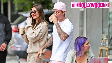 justin bieber gets mad and yells at paparazzi in a pink outfit while grabbing coffee with hailey
