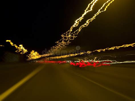 Car Lights Streaming By On A Snowy Evening Stock Image Image Of