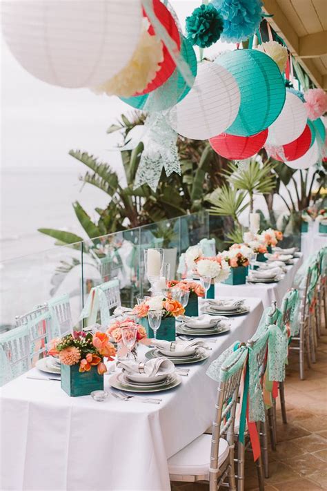 Ocean themed floral pieces with various shades of pinks. Beach Wedding Theme Ideas