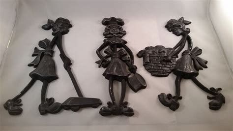 1971 vintage cast iron wall hangings cast by sistersvintageattic