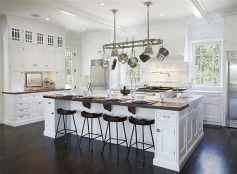 Expanding the black countertop of your kitchen island and put chairs around it can be done if you have a quite large space to begin with. 15 Kitchen Islands With Seating For Your Family Home