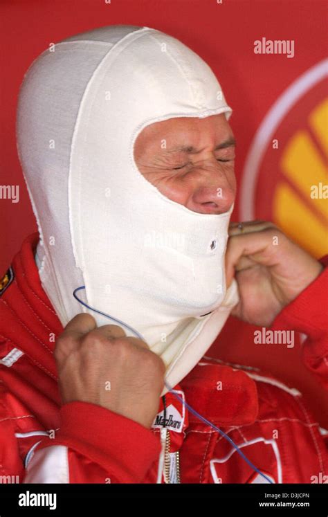 Dpa German Formula One Driver Michael Schumacher Of Ferrari Puts On