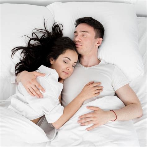 Top View Of Couple Sleeping Together In Bed Free Photo