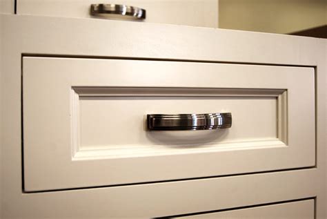 Kitchen cabinet hardware including pulls, knobs, and hinges. Cabinet Hardware - Builders Surplus