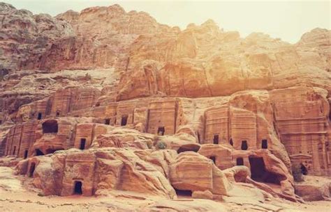 Petra Jordan Carved Into The Rosy Pink Sandstone Cliff Faces Of Desert