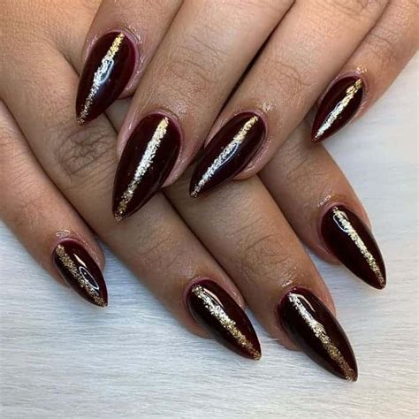 With an overall coat of dusty pink, the base color of these nails complements the rose gold metallic tips. 15 Hottest Maroon and Gold Nails to Copy - ChecoPie