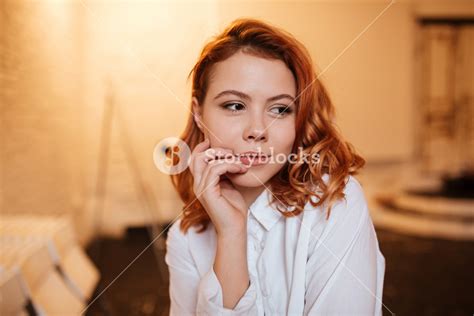 Picture Of Beautiful Redhead Young Woman Dressed In White Shirt Looking