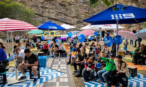 The locals relax under the cliffs and watch the live B105 broadcast. | The locals, Broadcast 
