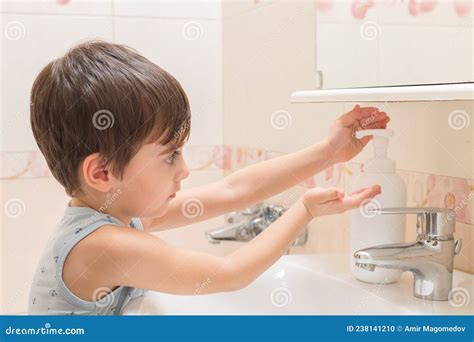 The Boy Soaps His Hands With Hand Washing Foam Stock Photo Image Of