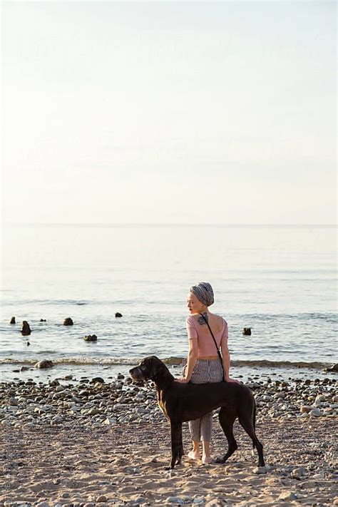 Woman With Dog At Ocean By Stocksy Contributor Danil Nevsky Big