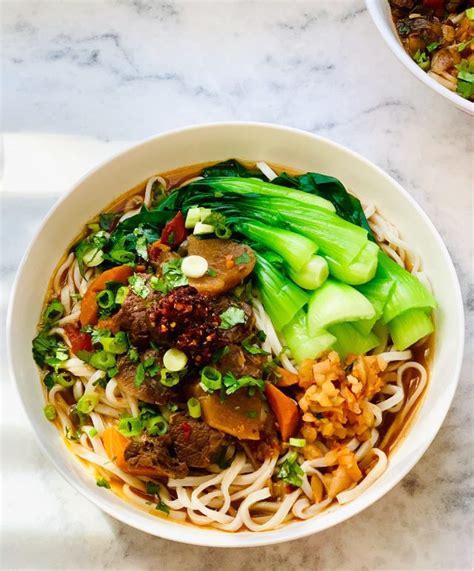Pour beef soup into noodle bowl, garnish with chopped green onions and cilantro. Chinese Beef Noodle Soup Recipe Authentic