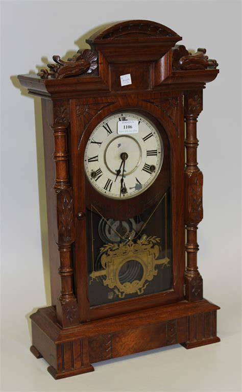 A Late 19th Century American Walnut Mantel Clock With Eight Day Three