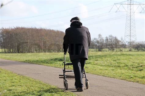 Walking Man With His Walker Stock Image Colourbox