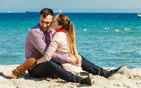Couple Hugging Sitting On The Sand Of The Beach Stock Photos Image My Xxx Hot Girl