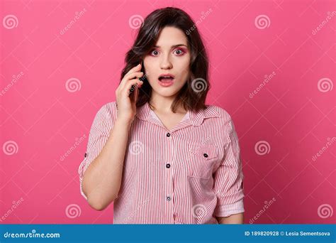 Shocked Lady With Widely Opened Mouth Talking To Phone Hears Shocking News Being Very