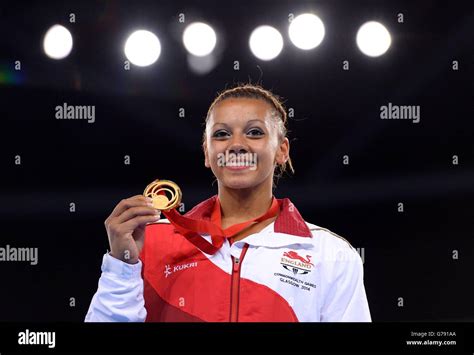 England S Rebecca Downie On The Podium With Her Gold Medal Following The Women S Uneven Bars