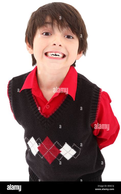 Adorable 7 Year Old Boy In Sweater Vest Suit Over White Background