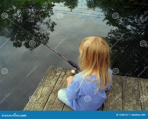 Little Girl Fishing From A Dock Royalty Free Stock Photography Image