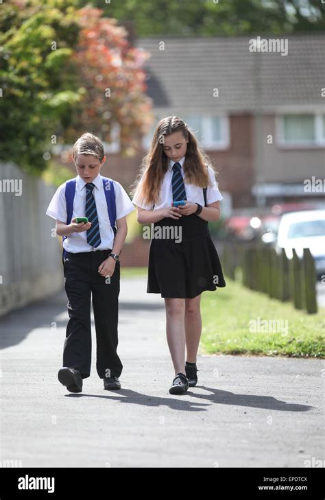 School Pupils In Uniform Walking To School Uk Stock Photo Alamy