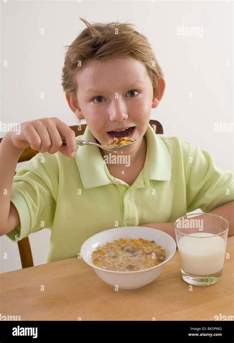 Little Boy Eating Cereal Stock Photo Alamy