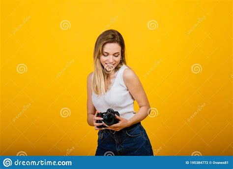 Excited Female Photographer Working In Studio Portrait Of Stunning