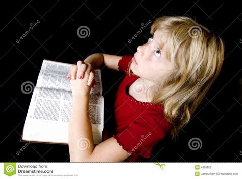 Little Girl Praying Over Bible Stock Photo Image Of