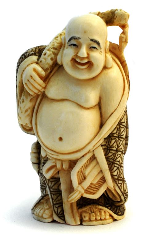 front of a netsuke depicting hotei made of mammoth ivory