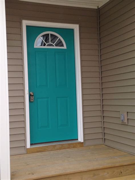 I want to change color schemes but can not decide on what would look best. Our front door. "Nifty Turquoise " Sherwin Williams. I ...