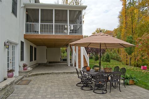 Screened Porch With Under Decking System And Paver Patio Archadeck Outdoor Living