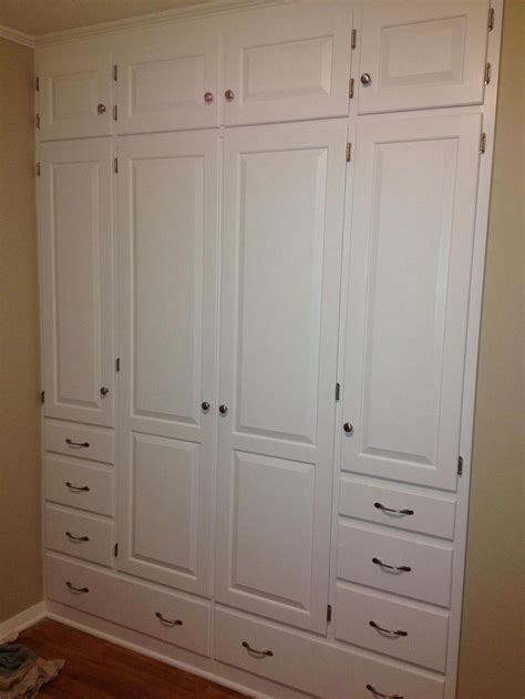 Once you have shimmed for plumb and level, secure the cabinets into the wall at the studs. CUSTOM CABINET WALL | Bedroom wall units, Build a closet ...