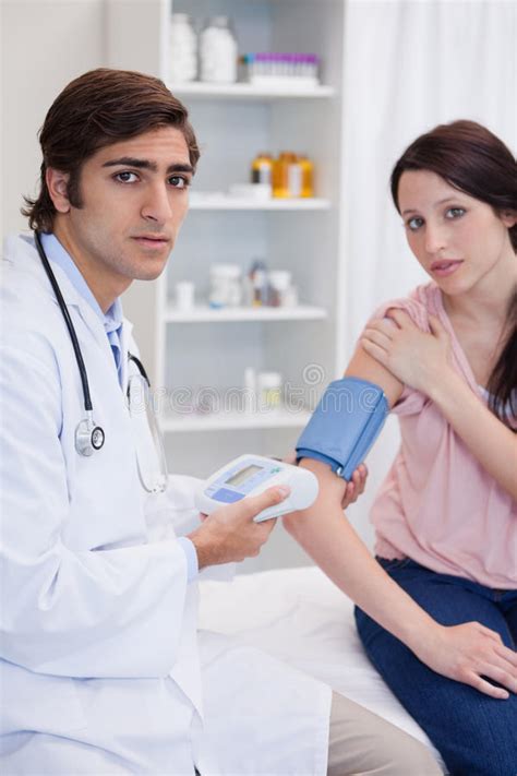 Doctor Examining Patients Blood Pressure Stock Image Image Of