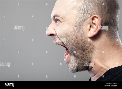 Angry Man Screaming Isolated On Gray Background Stock Photo Alamy