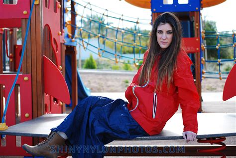 photoset 179 shiny nylon darkblue long skirt and red k way rainjacket