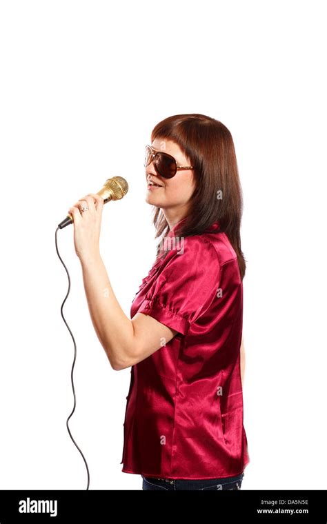 Woman With Big Sunglasses Singing Into A Microphone Stock Photo Alamy