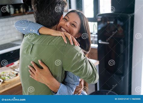happy couple in love bonding and hugging at home stock image image of embrace home 234312147