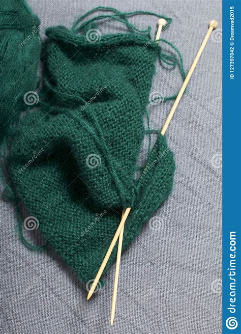 Knitting With Wooden Knitting A Ball Of Dark Green Thread And Wooden