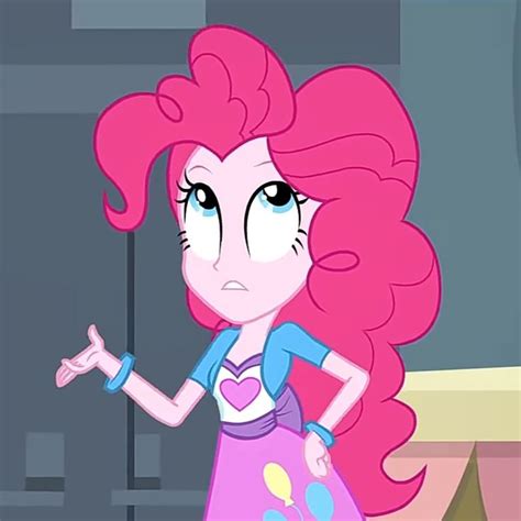 Pinkie Is Standing In Front Of A Window With Her Hand On Her Hip And