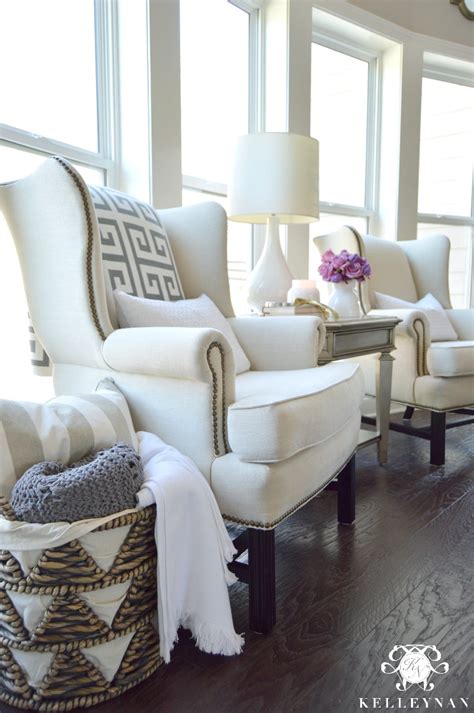 Kick back in an occasional chair that has plush rolled arm and a deep, cozy seat, or make a statement with a curvy bergère chair that would have been as at home in versailles as it is in your living room. Cool Tone Spring Ready Living Room Tour | Kelley Nan