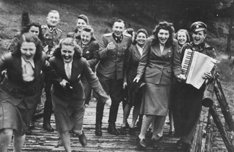 Nazi Officers And Female Auxiliaries Helferinnen Run Down A Wooden