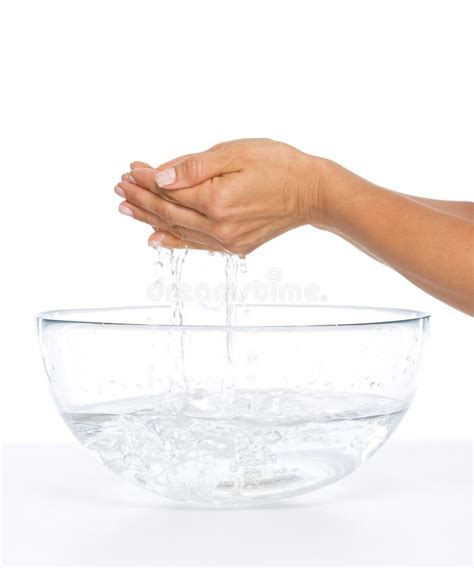 Closeup On Young Woman Washing Hands In Glass Bowl With Water Stock