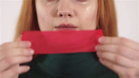 Young Upset Crying Woman With Long Hair Put Red Tape On Her Mouth With