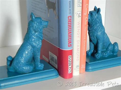 Two Bookends Made To Look Like Bears Sitting Next To Each Other On A Shelf