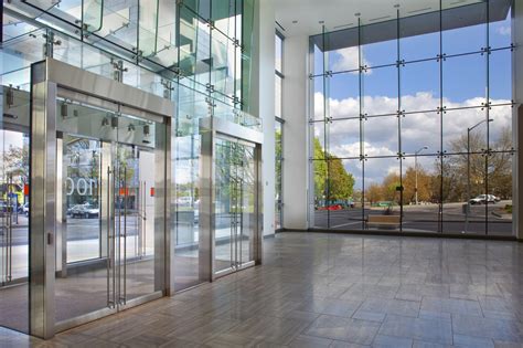 first and main structural glass wall systems vestibule enclosure elevator architectural glass