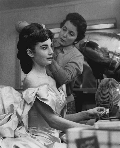 audrey hepburn getting flowers pinned in her hair for her role as marie vetsera in mayerling in